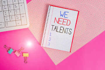 Word writing text We Need Talents. Business photo showcasing seeking for creative recruiters to join company or team Writing equipments and computer stuffs placed above colored plain table