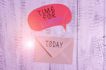 Handwriting text writing Time For Lunch. Conceptual photo Moment to have a meal Break from work Relax eat drink rest Front view closed envelop speech bubble lying wooden vintage background