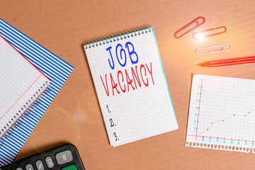 Handwriting text writing Job Vacancy. Conceptual photo job that no one is doing and available for someone to do Striped paperboard notebook cardboard office study supplies chart paper