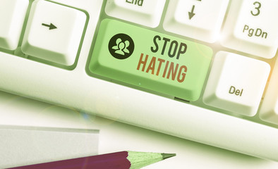 Writing note showing Stop Hating. Business concept for to drop all standards and wholeheartedly...