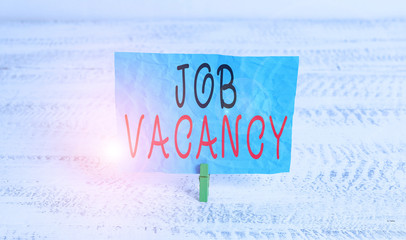 Word writing text Job Vacancy. Business photo showcasing job that no one is doing and available for someone to do Green clothespin white wood background colored paper reminder office supply