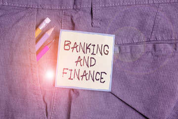 Text sign showing Banking And Finance. Business photo showcasing Accounting and entities stocks Money interests Writing equipment and green note paper inside pocket of man work trousers