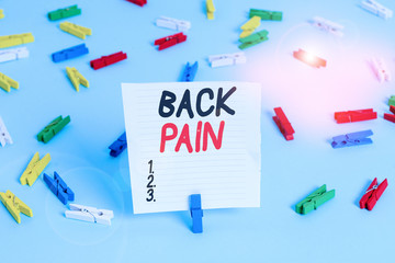 Word writing text Back Pain. Business photo showcasing Soreness of the bones felt at the lower back portion of the body Colored clothespin papers empty reminder blue floor background office pin