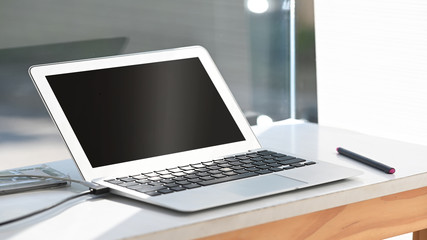 Fototapeta premium Small laptop computer on fixed table.