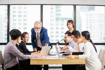 Successful Business team Meeting at meeting room in office, businessman  owner holding papers coworkers making great business discussion ,Teamwork training business success