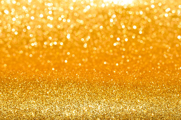 shine and sparkle of golden glitter abstract background	