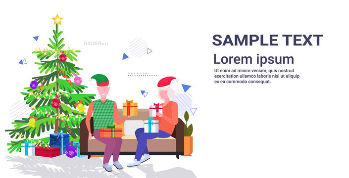 senior man in elf hat giving present gift box to mature woman family sitting on couch celebrating merry christmas happy new year winter holidays concept full length copy space horizontal vector