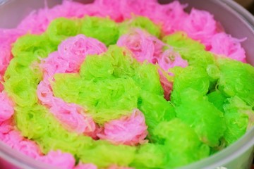 Thai dessert Colorful sweet-noodles or chilled sweet vermicelli for eating with water chestnuts in coconut milk syrup, thai street food market