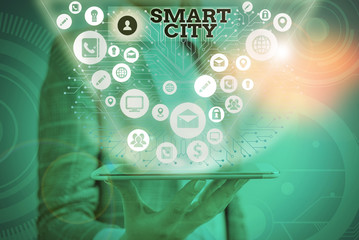 Conceptual hand writing showing Smart City. Concept meaning urban area that uses different...
