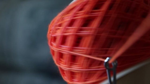 Orange Yarn Ball Winding Extreme Close Up 2