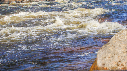 the surface water of a mountain river flows