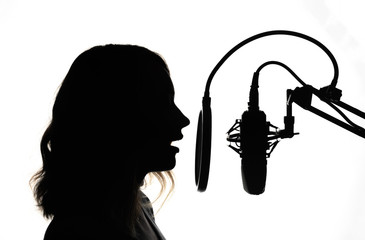 Female presenter of a radio station or news. Singer blogger. Black and white photo.