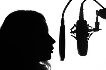 Female presenter of a radio station or news. Singer blogger. Black and white photo.