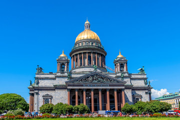 St. Isaac's Cathedral, a neoclassical Church with golden great dome against blue sky, in Saint-Petersburg, Russia.