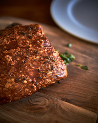 Yummy roasted pork belly with tasty crunchy crackling and parsley.