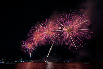 Colorful fireworks of various colors at night with celebration and anniversary concept