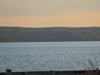 Reservoir at sunset on the background of the hill
