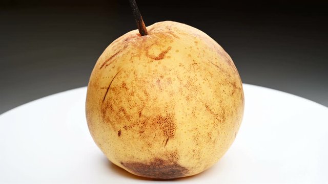 an overripe pear close up