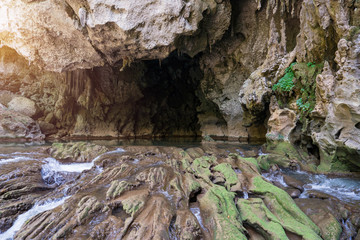 Tourists enjoy adventure in Lam Khlong Ngu cave at National Park Kanchanaburi Thailand