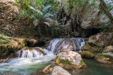 Naklejka na ściany i meble Tourists enjoy adventure in Lam Khlong Ngu cave at National Park Kanchanaburi Thailand