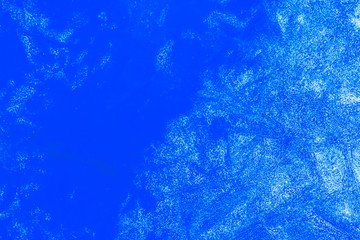 Fototapeta na wymiar blue texture of an ice surface with pure azure water ,cold snow cryslallized wall background ,winter frozen lake side close up , abstract macro wallpaper