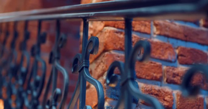 An interfloor span and a staircase with forged railing in a new brick building in the old classic style look very beautiful