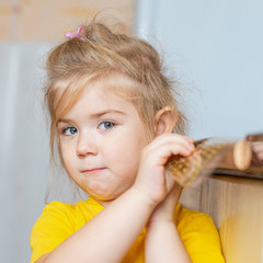 Portrait of a little sad girl indoors
