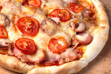 little homemade pizza lies on a wooden board