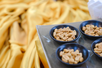 peanut in black bowl on buffet easily to take
