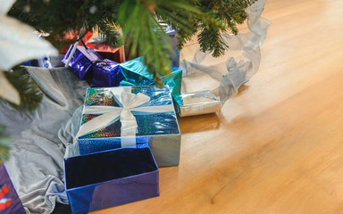 Gift boxes under christmas tree. Christmas time and Happy New Year celebration, Winter Holiday Concept