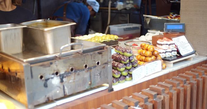 Asian dongo snacks at a concession stand in Kyoto, Japan lunch time,