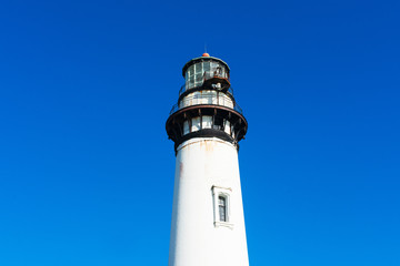 Weathered lighthouse on California Pacific Ocean coast