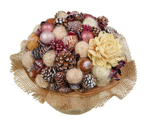 Christmas homemade wreath bouquet  in rustic pink and red style made  pine cones,  nuts, bells and so on isolated