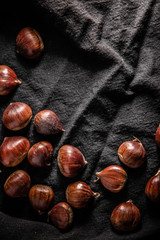 Chestnuts on a dark table