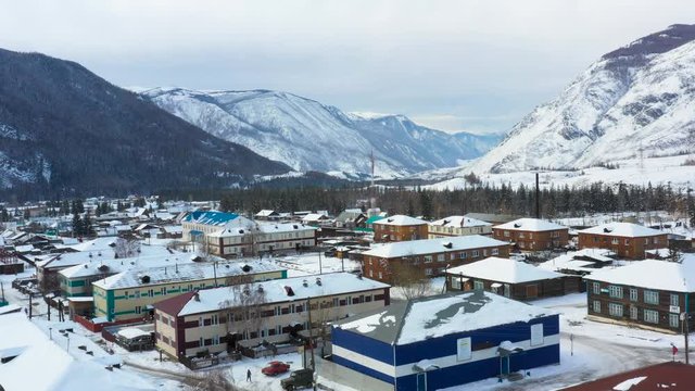 A small village located among the great mountains of Altai, filmed with a quadcopter
