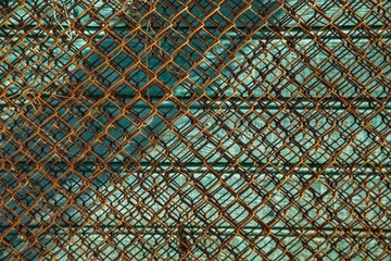 Rusty metal mesh close up on wooden background abstract texture background