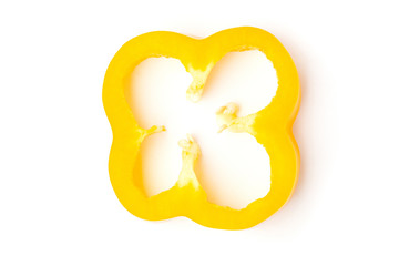 Top view (flat lay) sliced ​​yellow bell pepper isolated on a white background.