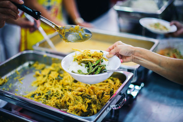 Social hunger: Volunteers provide food assistance to poor people who need food.