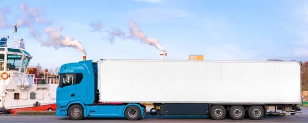 Foto op Aluminium blue truck delivery commercial cargo with refrigerator trailer. Copy space. © Igor