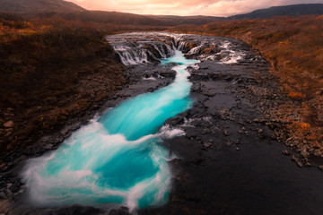 Bruarfoss turquoise waterfall next to Brekkuskógur at South Iceland.	