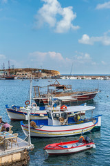 Fototapeta na wymiar view of small boats in the harbor in the Greek resort town of Hersonissos