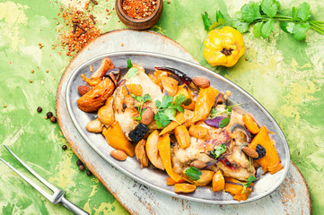 Baked chicken with pumpkin.