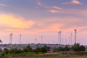 Obraz premium Wind turbine power generator at twilight