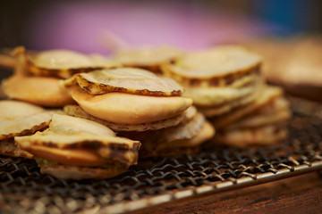 Scallop skewer on BBQ grill 