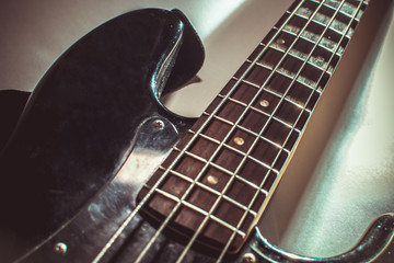 details electric bass guitar with strings close up