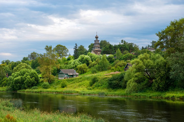 Fototapeta na wymiar View of the Church of the Icon of the Mother of God of Tikhvin in Torzhok from the banks of the Tvertsa River in town Torzhok. Tver region. Russia