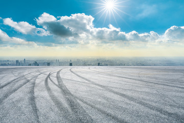 Asphalt race track and modern city skyline in Shanghai.