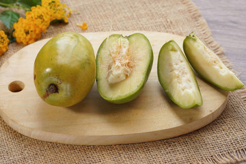Kedondong or ataheitte apple/great hot plum on cutting board