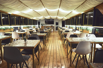 interior details of restaurant on the ship. Concept of interior design of a restaurant on a ship