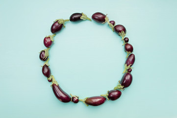 Round eggplant frame with empty space for text. Healthy food concept, top view, flat lay.